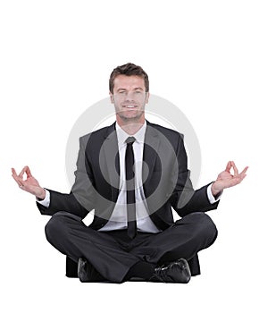 Closeup of attractive young man meditating isolated on white