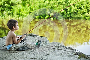 Calm child fisherman