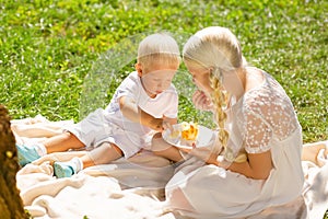 Calm children eating sweets in the park