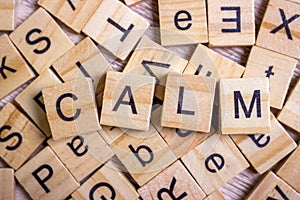 calm - cube with letters, sign with wooden cubes