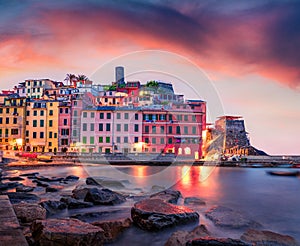 Calm dawn cityscape of Vernazza port. Exciting summer sunrise on Liguria, Cinque Terre, Italy, Europe. Dramatic seascape of Medite