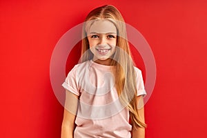 Calm diligent child girl with long hair isolated