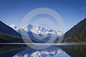 Calm Duffy Lake and snow covered mountains photo