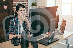 Calm female photographer woman working at office