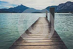 Calm lake of Mondsee in Austria, view from the wooden pier