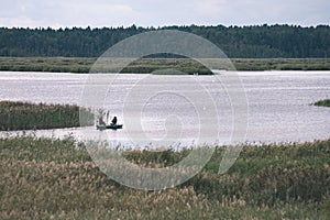 calm lake with reflections of clouds in summer- vintage retro l