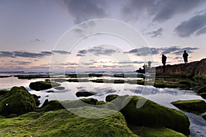 Calm landscape with fishermen