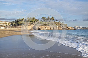 Calm late afternoon views of the empty beach known as Playa del Duque located in Costa Adeje, Tenerife, Canary Islands, Spain