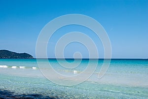 Calm Mediterranean Sea under solid blue sky