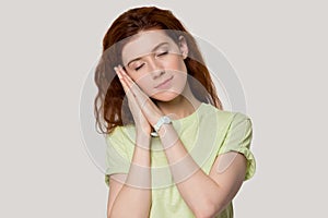 Calm millennial woman feeling sleepy head shot portrait.