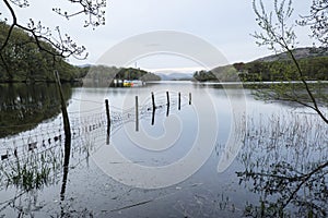 Calm moody evening landscape over Coniston Water in English Lake