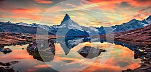 Calm morning view of Stellisee lake with Matterhorn / Cervino peak on background. Exotic autumn scene of Swiss Alps, Zermatt resor