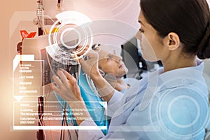 Calm nurse touching the wires while preparing everything for the EEG