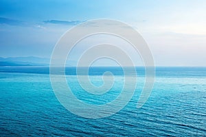 Calm ocean and hazy sky view, likely for nature background