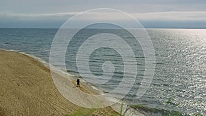 Calm ocean waves crash in nature landscape. Couple running sea beach background.