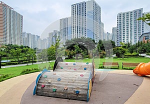 Calm and peaceful park surrounded by high rise apartment building in new town