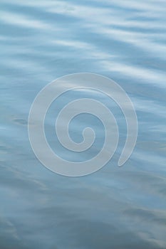 Calm peaceful reflective water surface flowing bright in Oregon lake pond swamp or river