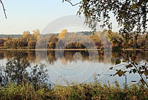 Calm and relaxation emanate from the amazing autumn landscape of the water surface.