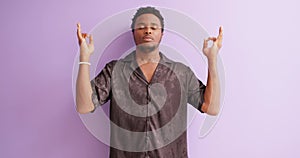 calm relaxed black man hold spread hand in yoga om arm gesture