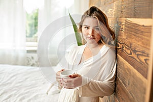 Calm relaxed redhead woman at home