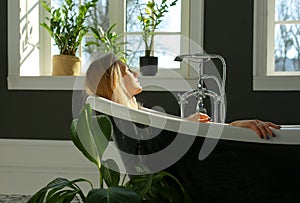 Calm relaxed woman in bath