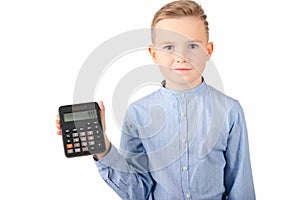 Calm Schoolboy holding calculator. Portrait of funny cute 10s boy .White background