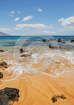 Calm sea beach background. Summer tropical beach with sand. Ocean water. Natural seascape.