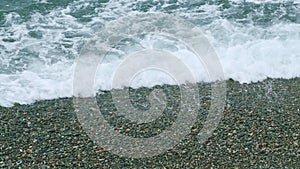 Calm Sea Surface. Blurred Soft Foamy Waves Washing Pebbled Beach. Still.