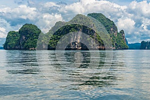 calm sea surface, picturesque cliff in the sea, Thailand