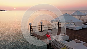 Calm sea and wooden pier in the evening.