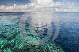 Calm Seas, Blue Sky, and Coral Reef Dropoff