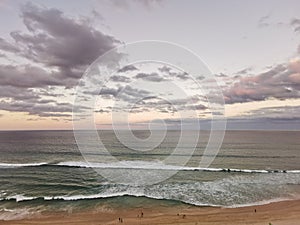 Calm serene tranquil twilight evening scene of Surfer Paradise beach in Gold Coast Australia from bird eye view. There are many