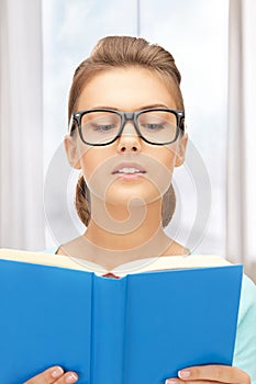 Calm and serious woman with book