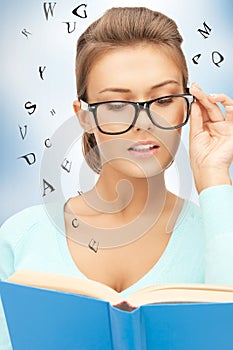 Calm and serious woman with book