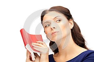 Calm and serious woman with book