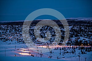 Calm Skiing resort during the night. Winter holiday in the mountains, beautiful view, snow and skiing.