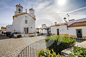 Small square with a church in traditional village  Vila Fernando  Alentejo  Portugal