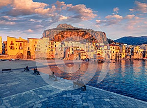 Calm sunday evening in Cefalu town. Amazing sunset on Mediterranean sea, Sicily, Italy, Europe.