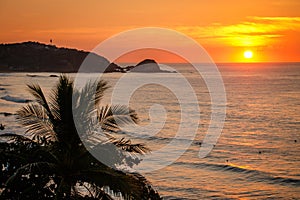 Calm sunset scene of Zipolite beach in Southern Mexico photo