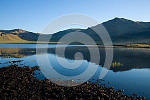 Calm water on the Great White Lake. Mongolia.