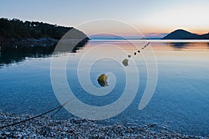 Calm water at Panormos beach after sunset, Skopelos island