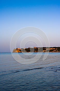 Calm waters of Ionian Sea during warm, summer sunset during vacation trip to Zakynthos Island, Greece