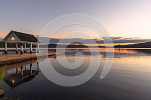 Calm waters of a lake reflecting the sky at dusk