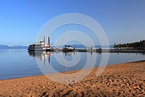 Lake Tahoe Paddlewheeler at Dock at Zephyr Cove from Sandy Beach, Sierra Nevada, USA photo