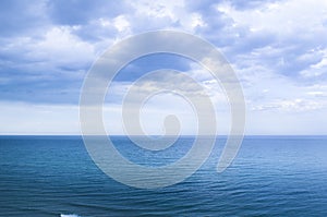 Calm windless ocean in blue tones