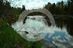 Calm Wisconsin River With Reflecting Clouds