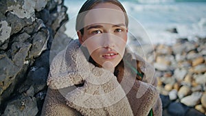 Calm woman dreaming coast enjoying solitude at ocean. Closeup peaceful girl