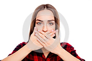 Calm woman making tabu gesture and covering mouth with hands