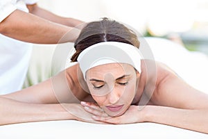 Calm woman receiving reiki treatment