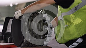 Calm workers controlling aircraft machine and chassis. Aircraft maintenance mechanic inspects plane chassis. Installing